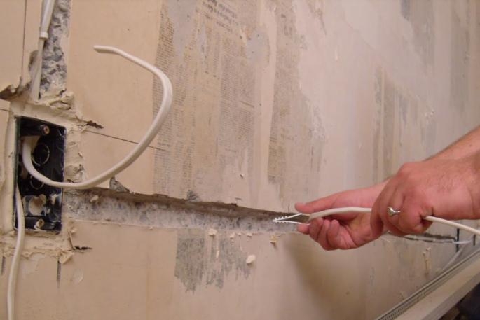 What are the dangers of old electrical wiring in a house?